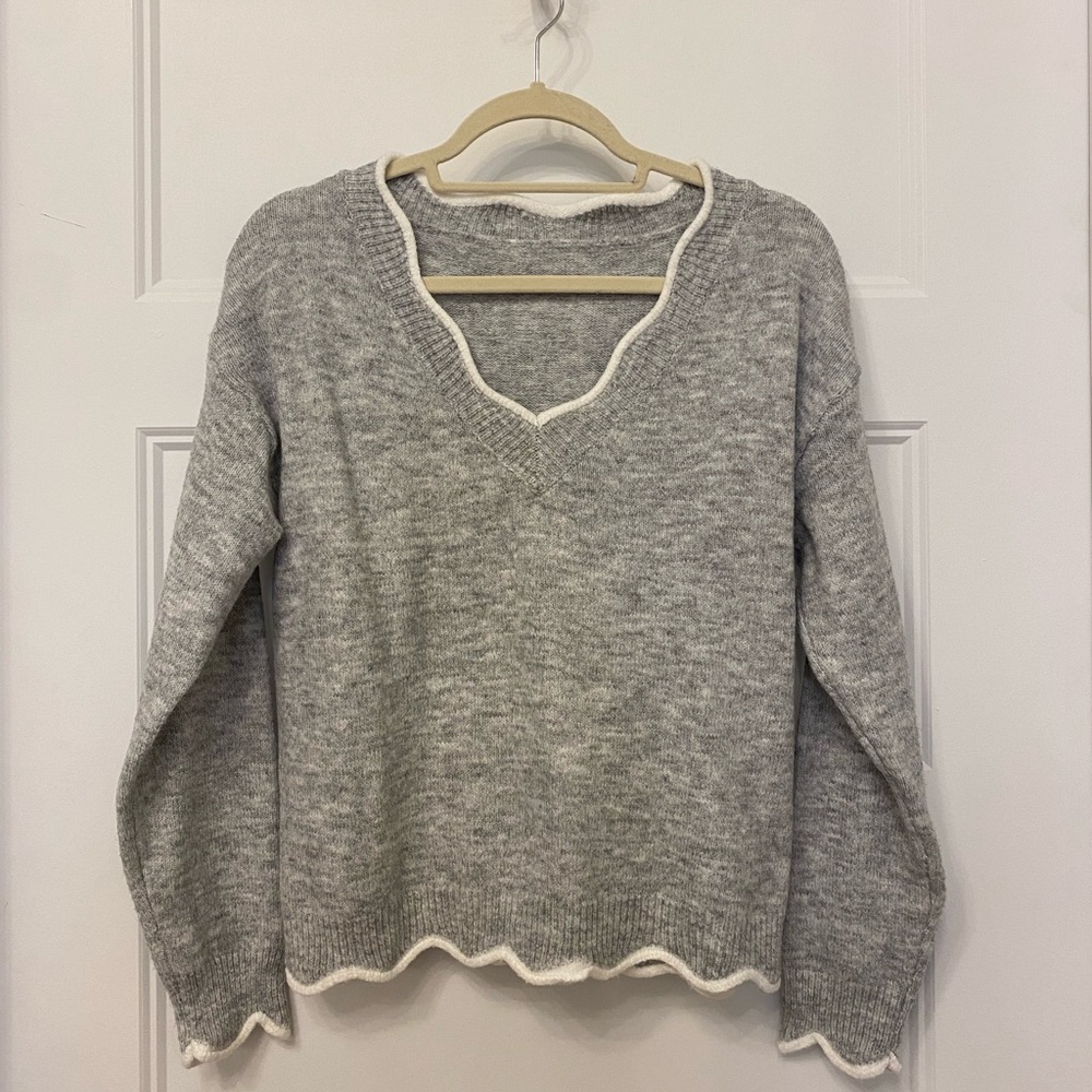 Grey scoop neck sweater with white accent. No tags but never worn